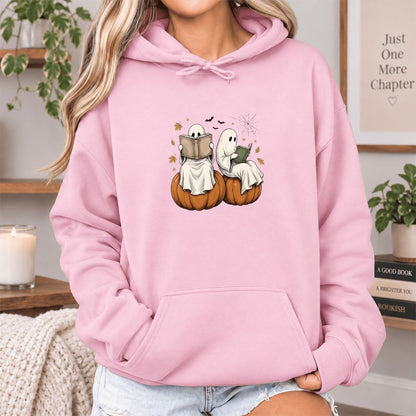 Small Ghosts Reading on Pumpkins Softstyle Hoodie | Spooky Book Lover Gift Light Pink