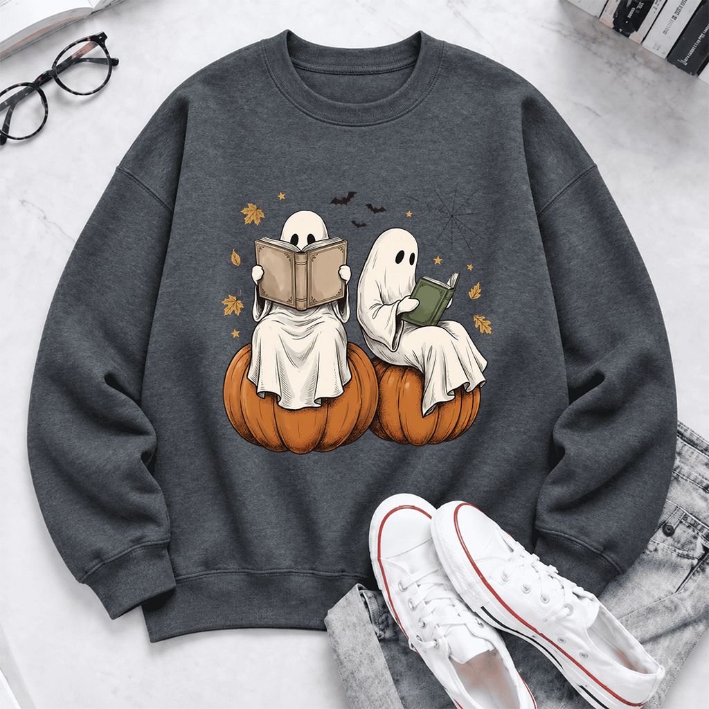 Small Ghosts Reading on Pumpkins Softstyle Sweatshirt | Spooky Book Lover Gift Dark Heather