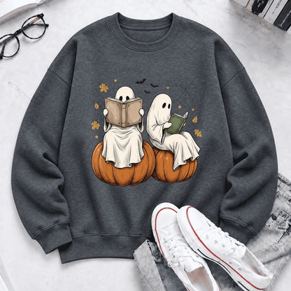 Small Ghosts Reading on Pumpkins Softstyle Sweatshirt | Spooky Book Lover Gift Dark Heather
