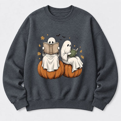Small Ghosts Reading on Pumpkins Softstyle Sweatshirt | Spooky Book Lover Gift Dark Heather
