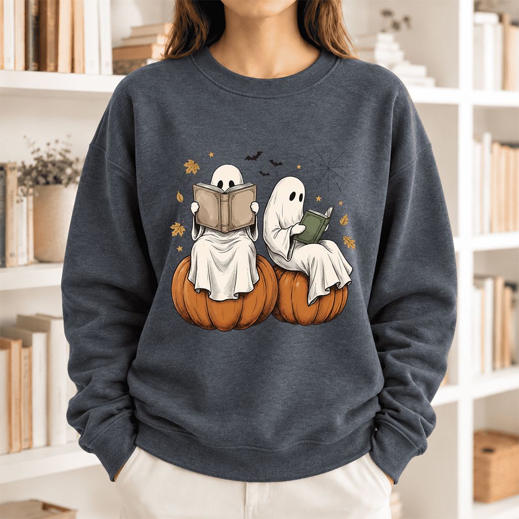 Small Ghosts Reading on Pumpkins Softstyle Sweatshirt | Spooky Book Lover Gift Dark Heather