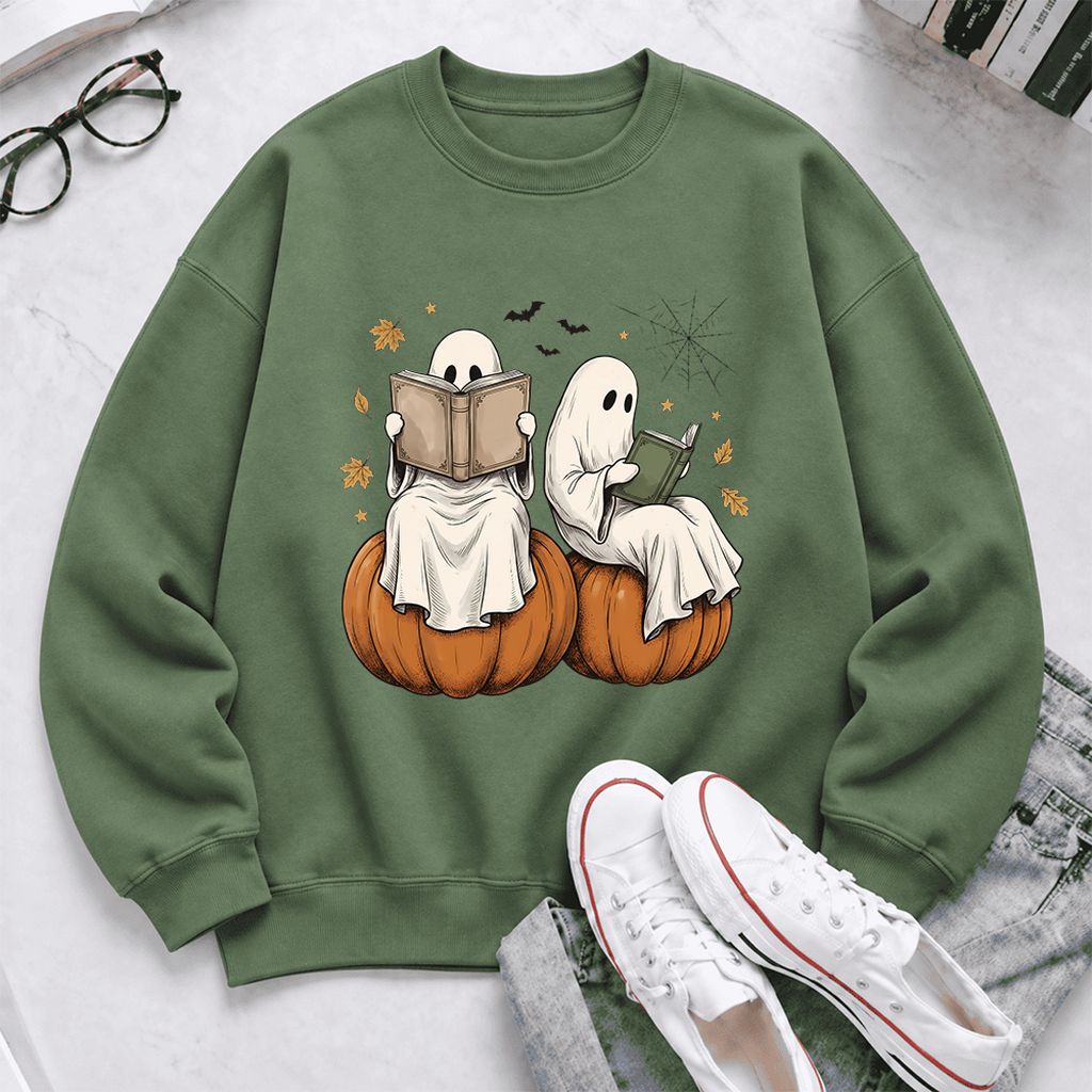 Small Ghosts Reading on Pumpkins Softstyle Sweatshirt | Spooky Book Lover Gift Military Green