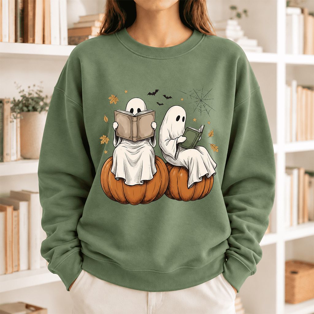 Small Ghosts Reading on Pumpkins Softstyle Sweatshirt | Spooky Book Lover Gift Military Green