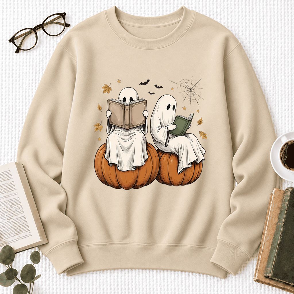 Small Ghosts Reading on Pumpkins Softstyle Sweatshirt | Spooky Book Lover Gift Sand