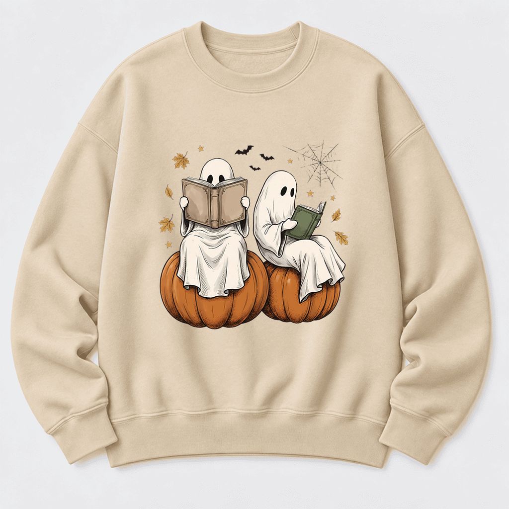 Small Ghosts Reading on Pumpkins Softstyle Sweatshirt | Spooky Book Lover Gift Sand