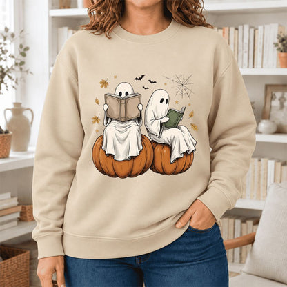 Small Ghosts Reading on Pumpkins Softstyle Sweatshirt | Spooky Book Lover Gift Sand