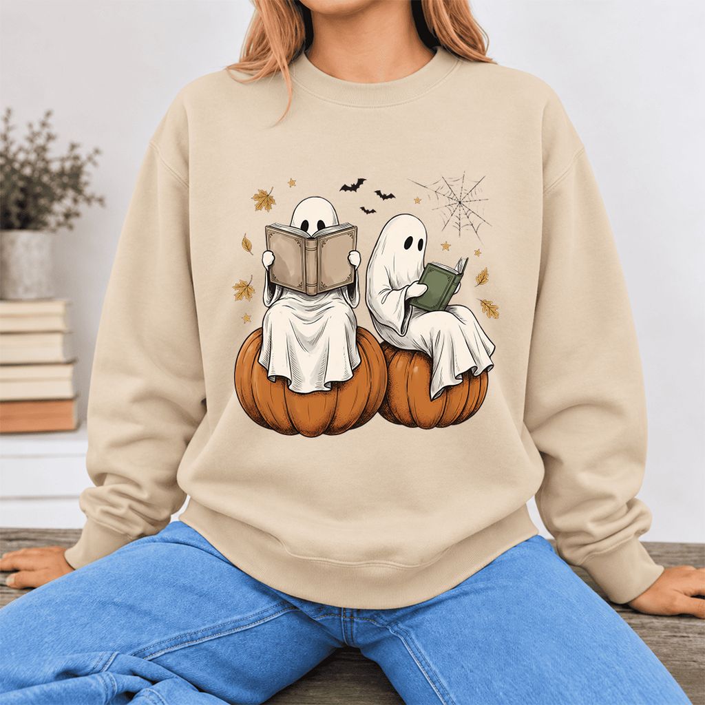 Small Ghosts Reading on Pumpkins Softstyle Sweatshirt | Spooky Book Lover Gift Sand