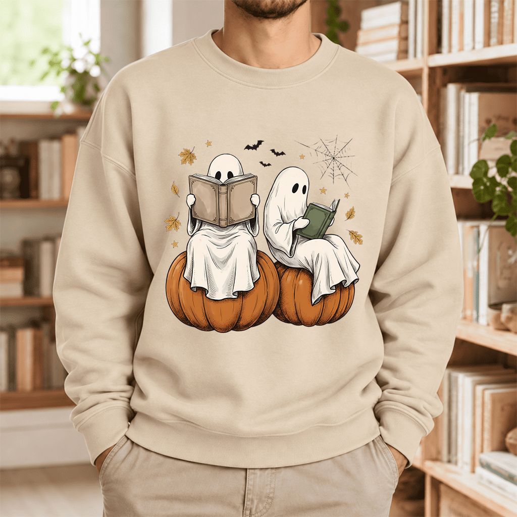 Small Ghosts Reading on Pumpkins Softstyle Sweatshirt | Spooky Book Lover Gift Sand