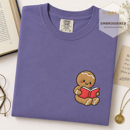 Gingerbread Character With Red Book Embroidered T-Shirt | Christmas Reader Gift Grape