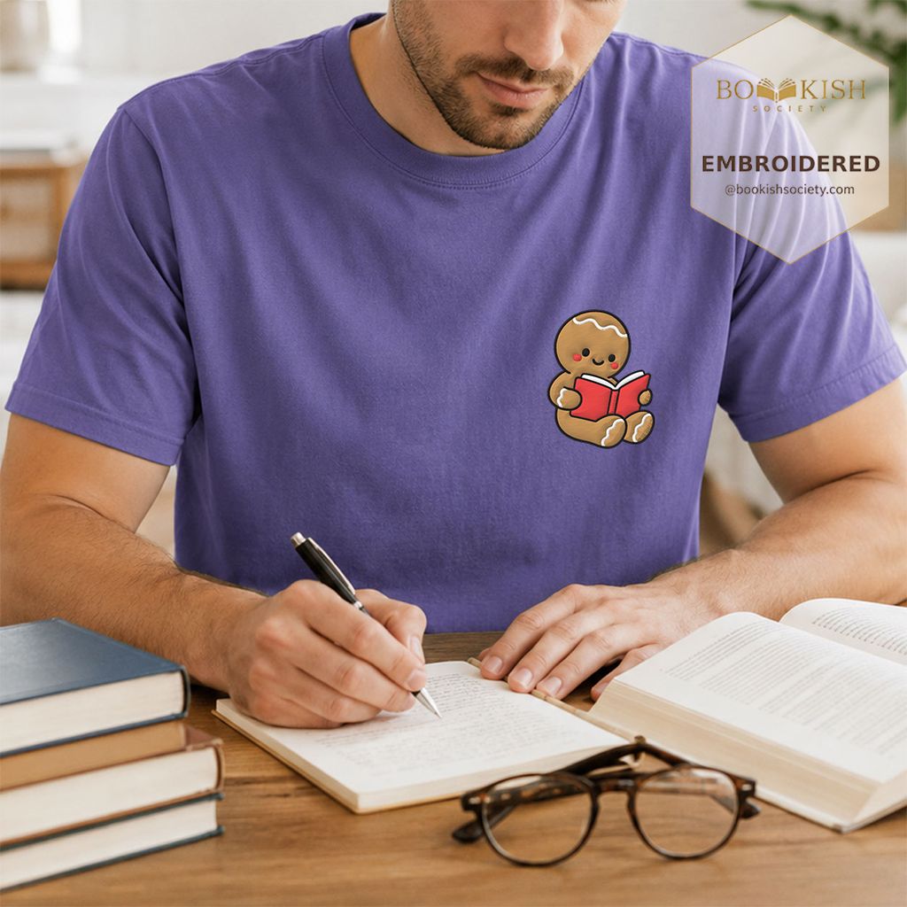 Gingerbread Character With Red Book Embroidered T-Shirt | Christmas Reader Gift Grape