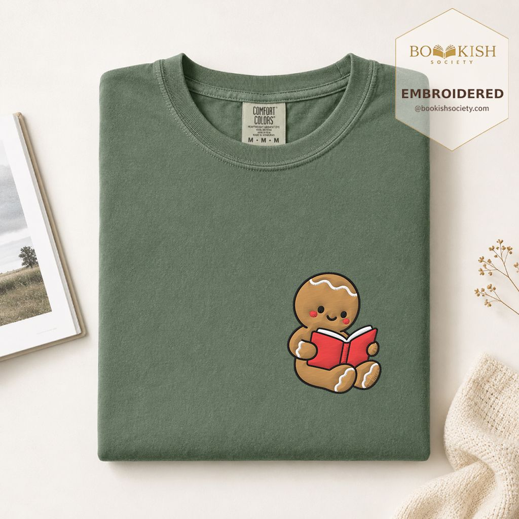 Gingerbread Character With Red Book Embroidered T-Shirt | Christmas Reader Gift Moss