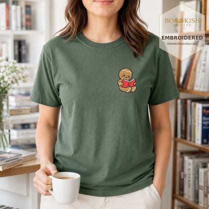 Gingerbread Character With Red Book Embroidered T-Shirt | Christmas Reader Gift Moss