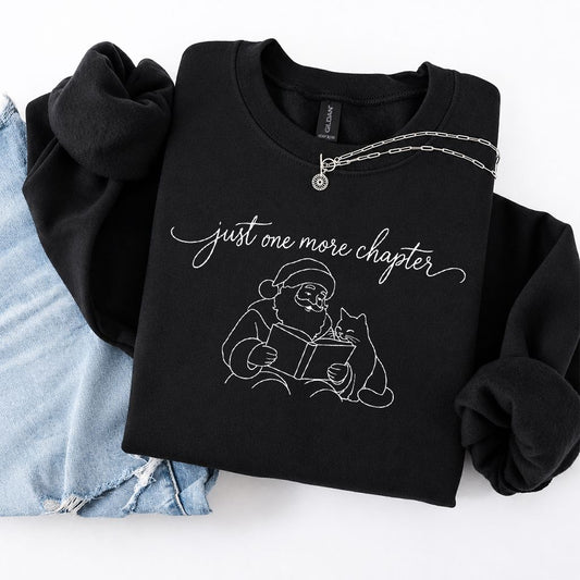 Just One More Chapter Santa And Cat Crewneck Sweatshirt | Cat Lover Reader Gift Black