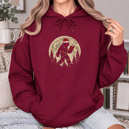 Big Foot Wearing Christmas Hat Softstyle Hoodie | Christmas Reader Gift Maroon