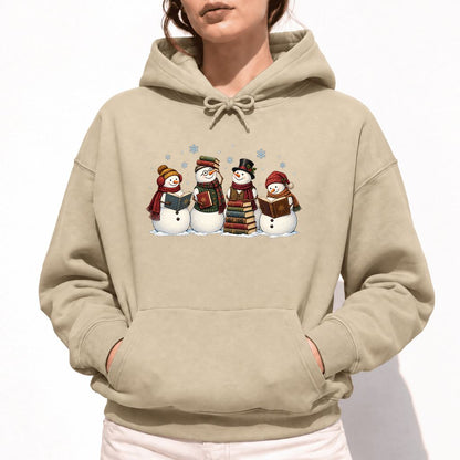 Four Snowmen Reading Softstyle Hoodie | Christmas Book Lover Gift Sand
