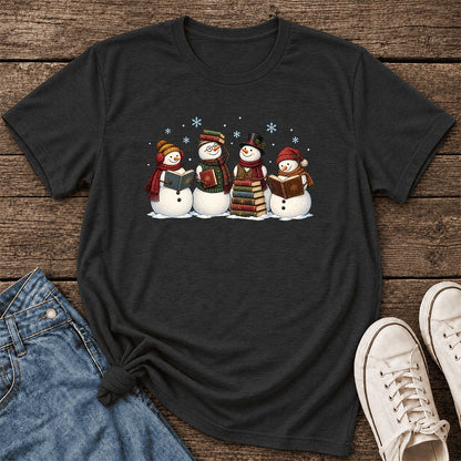 Four Snowmen Cozy Reading Ultra-Soft Cotton T-Shirt | Christmas Reader Gift Black Heather