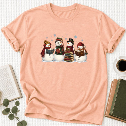 Four Snowmen Cozy Reading Ultra-Soft Cotton T-Shirt | Christmas Reader Gift Heather Peach