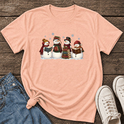 Four Snowmen Cozy Reading Ultra-Soft Cotton T-Shirt | Christmas Reader Gift Heather Peach