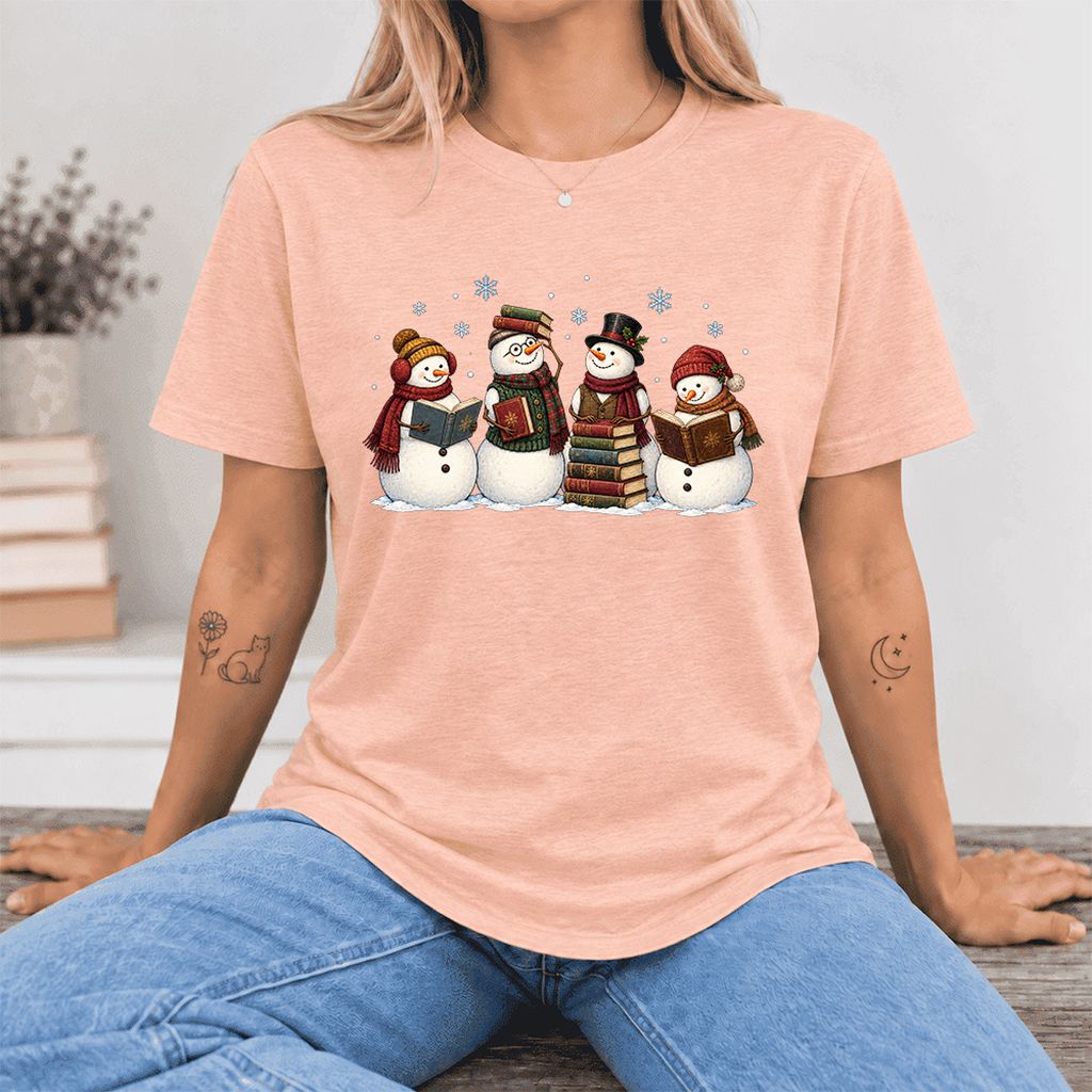 Four Snowmen Cozy Reading Ultra-Soft Cotton T-Shirt | Christmas Reader Gift Heather Peach