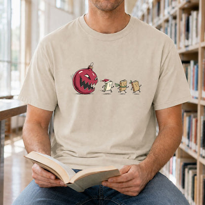 Christmas Book Chase Printed T-Shirt | Holiday Book Lover Gift Sand