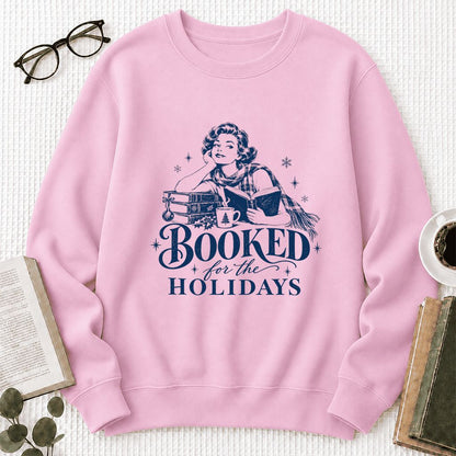 Booked for the Holidays Printed Sweatshirt | Christmas Reader Gift Light Pink