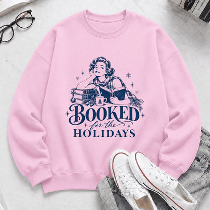 Booked for the Holidays Printed Sweatshirt | Christmas Reader Gift Light Pink