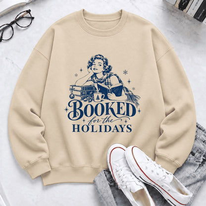 Booked For The Holidays Softstyle Sweatshirt | Cozy Christmas Reader Gift Sand