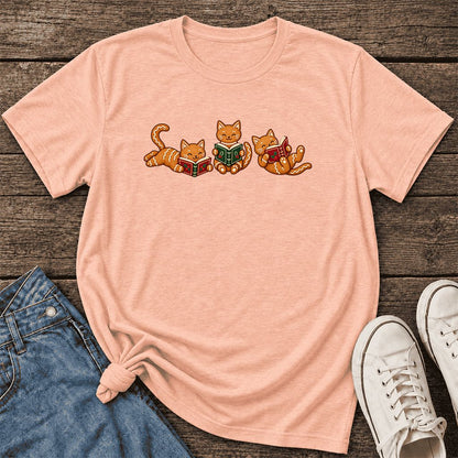 Cozy Gingerbread Cats Reading Books Ultra-Soft Cotton T-Shirt | Christmas Gift Heather Peach