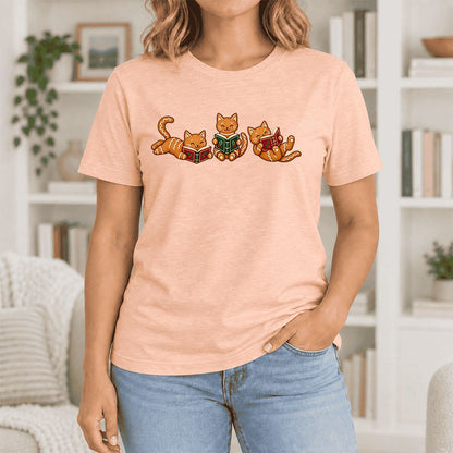 Cozy Gingerbread Cats Reading Books Ultra-Soft Cotton T-Shirt | Christmas Gift Heather Peach