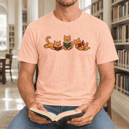 Cozy Gingerbread Cats Reading Books Ultra-Soft Cotton T-Shirt | Christmas Gift Heather Peach