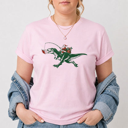Santa Riding T-Rex Printed T-Shirt | Christmas Reader Gift Light Pink