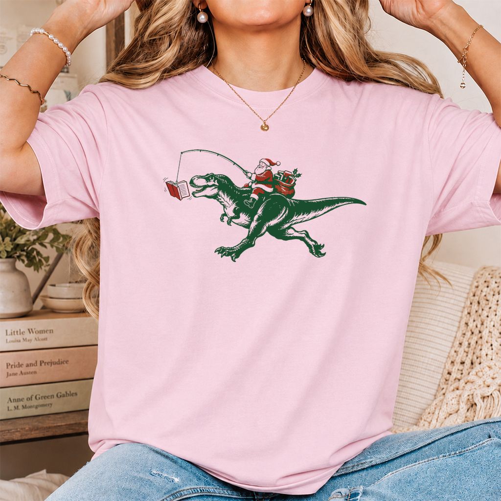Santa Riding T-Rex Printed T-Shirt | Christmas Reader Gift Light Pink