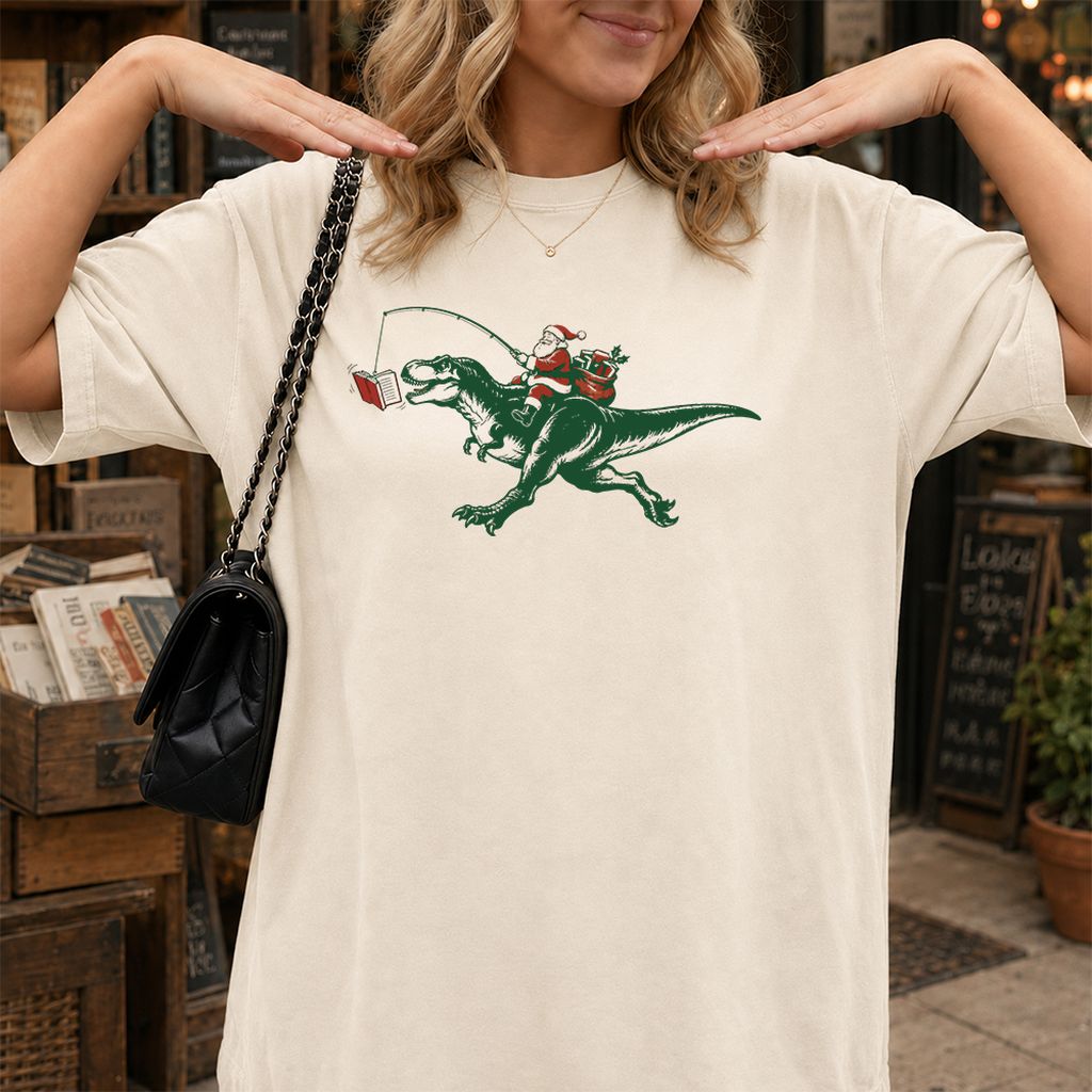 Santa Riding T-Rex Printed T-Shirt | Christmas Reader Gift Natural