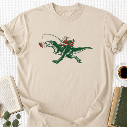 Santa Riding T-Rex Printed T-Shirt | Christmas Reader Gift Sand