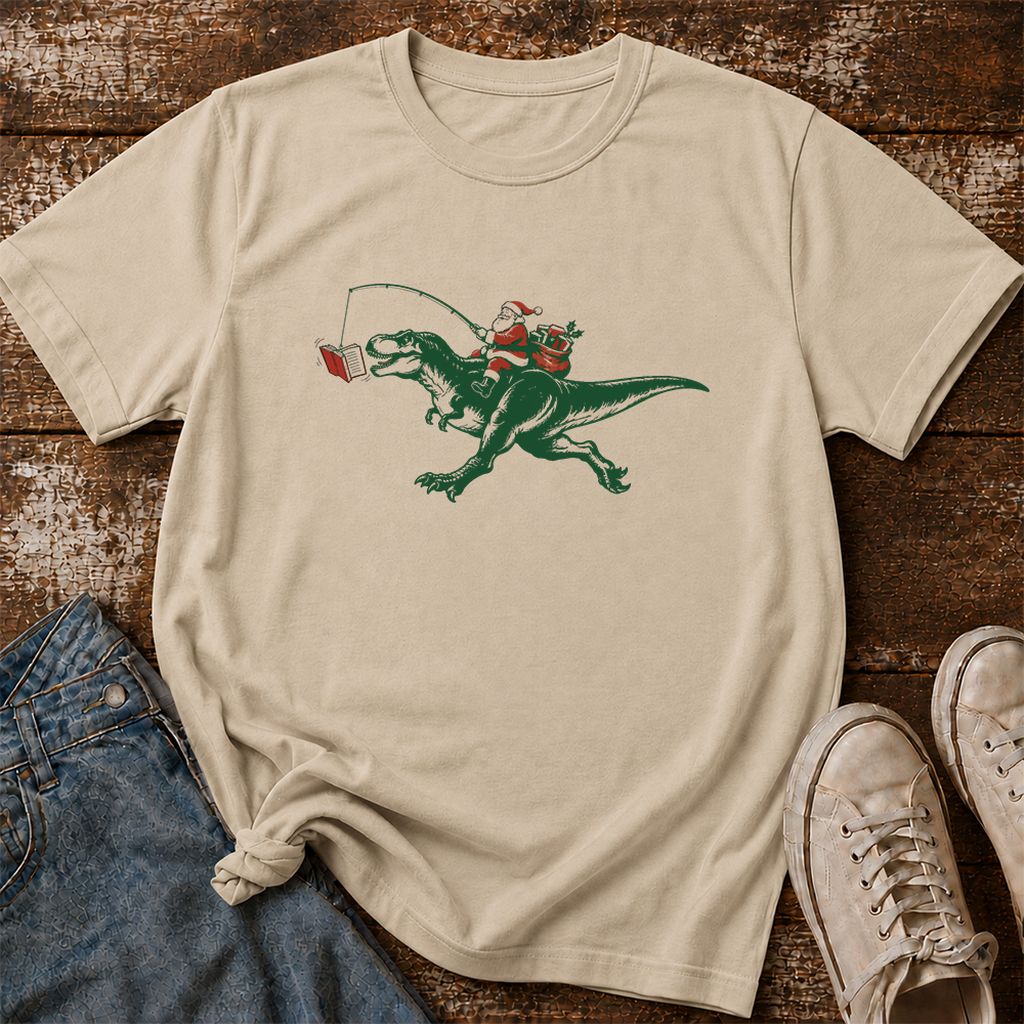 Santa Riding T-Rex Printed T-Shirt | Christmas Reader Gift Sand