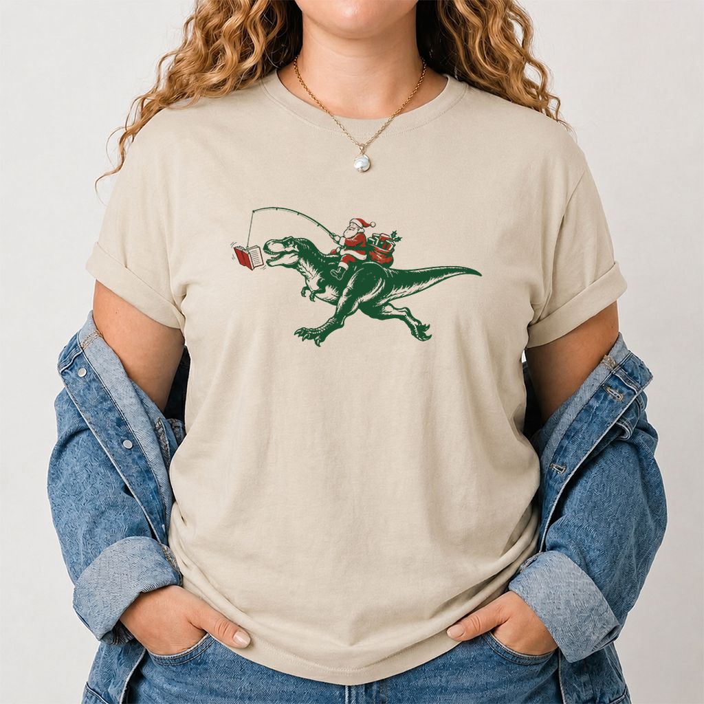 Santa Riding T-Rex Printed T-Shirt | Christmas Reader Gift Sand