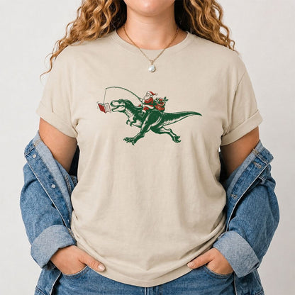 Santa Riding T-Rex Printed T-Shirt | Christmas Reader Gift Sand