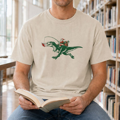 Santa Riding T-Rex Printed T-Shirt | Christmas Reader Gift Sand