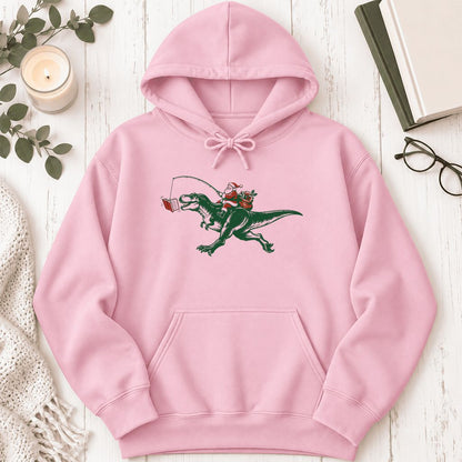 Santa Riding T-Rex Softstyle Hoodie | Christmas Reader Gift Light Pink