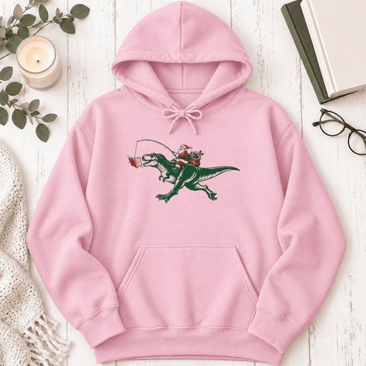 Santa Riding T-Rex Softstyle Hoodie | Christmas Reader Gift Light Pink