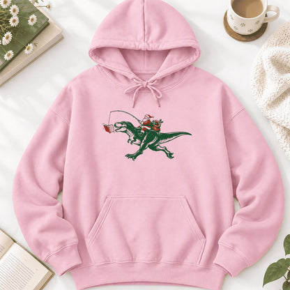 Santa Riding T-Rex Softstyle Hoodie | Christmas Reader Gift Light Pink
