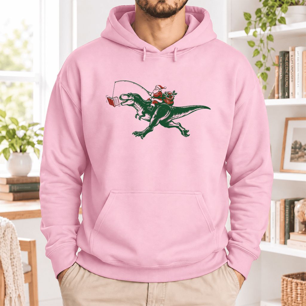Santa Riding T-Rex Softstyle Hoodie | Christmas Reader Gift Light Pink