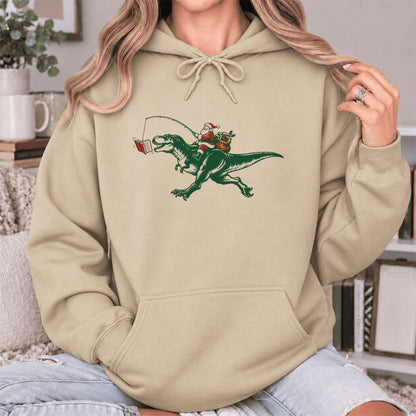 Santa Riding T-Rex Softstyle Hoodie | Christmas Reader Gift Sand