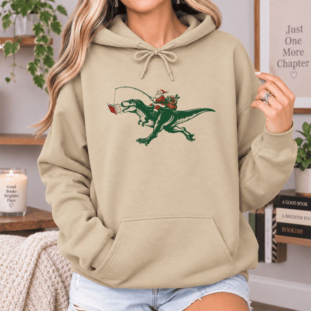 Santa Riding T-Rex Softstyle Hoodie | Christmas Reader Gift Sand