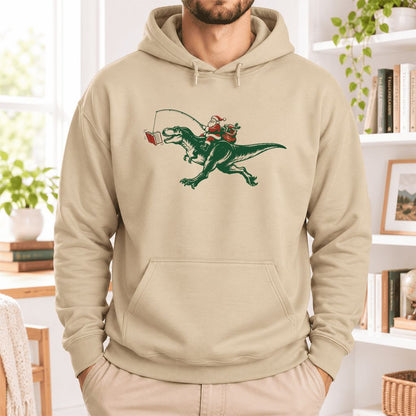 Santa Riding T-Rex Softstyle Hoodie | Christmas Reader Gift Sand
