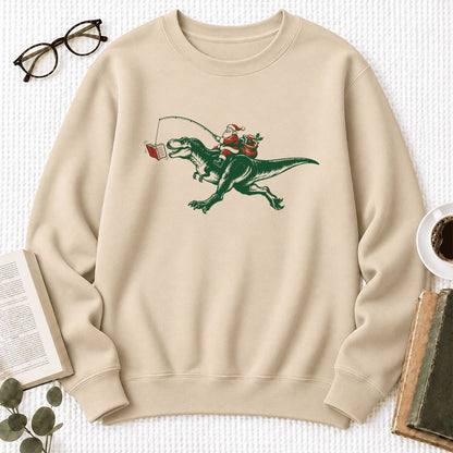 Santa Riding T-Rex Softstyle Sweatshirt | Christmas Reader Gift Sand