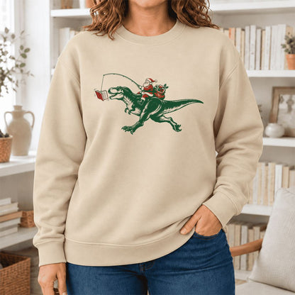 Santa Riding T-Rex Softstyle Sweatshirt | Christmas Reader Gift Sand