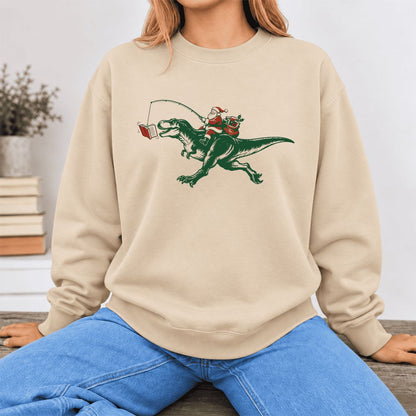 Santa Riding T-Rex Softstyle Sweatshirt | Christmas Reader Gift Sand