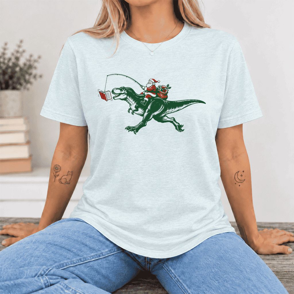 Santa Riding T-Rex Ultra-Soft Cotton T-Shirt | Christmas Reader Gift Heather Ice Blue