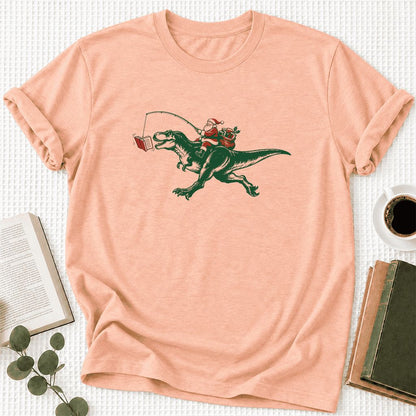 Santa Riding T-Rex Ultra-Soft Cotton T-Shirt | Christmas Reader Gift Heather Peach